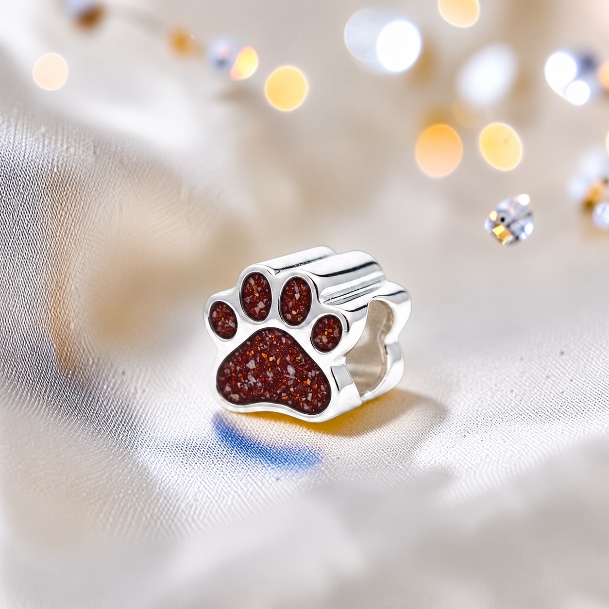 Lily paw silver ashes charm, in ruby red, handcrafted in Lancashire UK - by Keepsake Memorial Jewellery 
