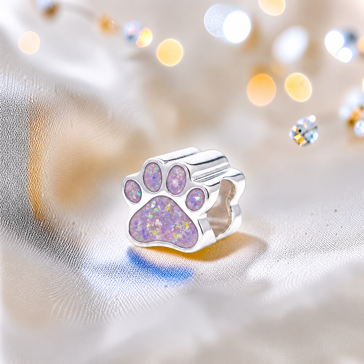 Lily paw silver ashes charm, in unicorn purple, handcrafted in Lancashire UK - by Keepsake Memorial Jewellery 