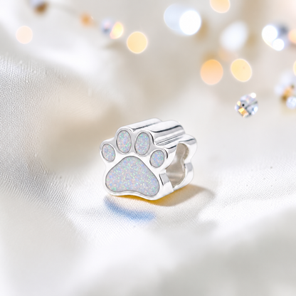 Lily paw silver ashes charm, in white snow, handcrafted in Lancashire UK - by Keepsake Memorial Jewellery 