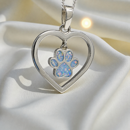Lily pendant - heart shaped memorial ashes pendant with central paw charm in baby blue, handcrafted in Lancashire UK - by Keepsake Memorial Jewellery