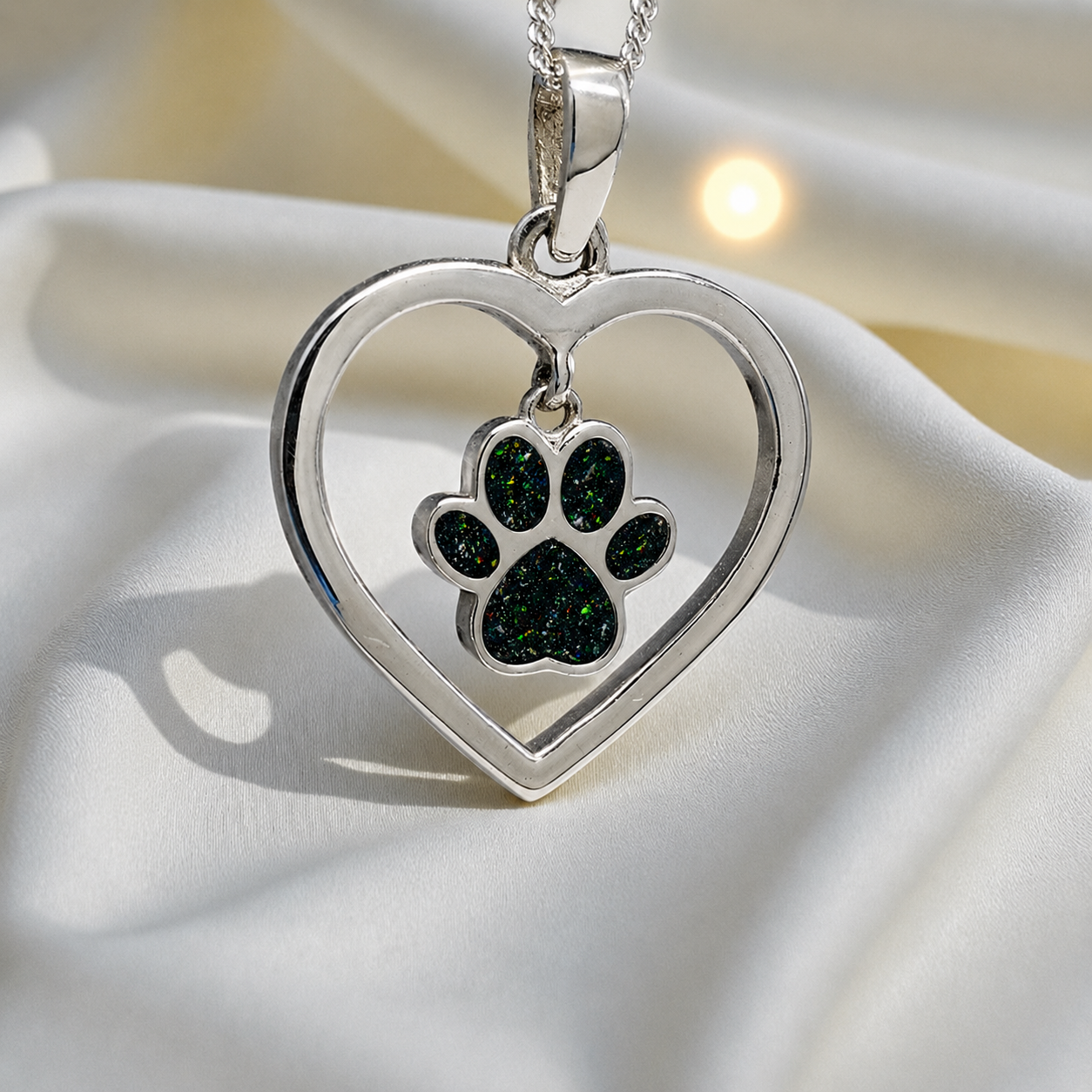 Lily pendant - heart shaped memorial ashes pendant with central paw charm in black flame, handcrafted in Lancashire UK - by Keepsake Memorial Jewellery