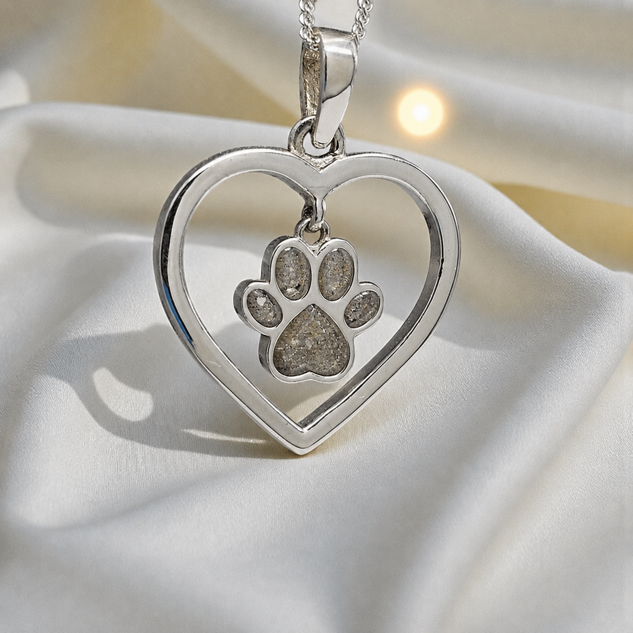 Lily pendant - heart shaped memorial ashes pendant with central paw charm in natural ash, handcrafted in Lancashire UK - by Keepsake Memorial Jewellery