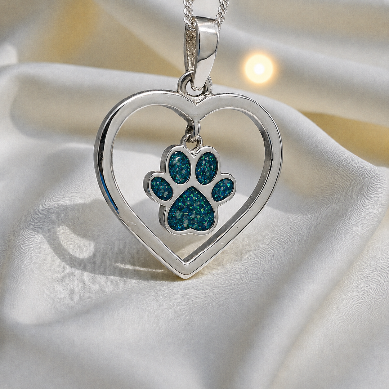 Lily pendant - heart shaped memorial ashes pendant with central paw charm in teal mist, handcrafted in Lancashire UK - by Keepsake Memorial jewellery
