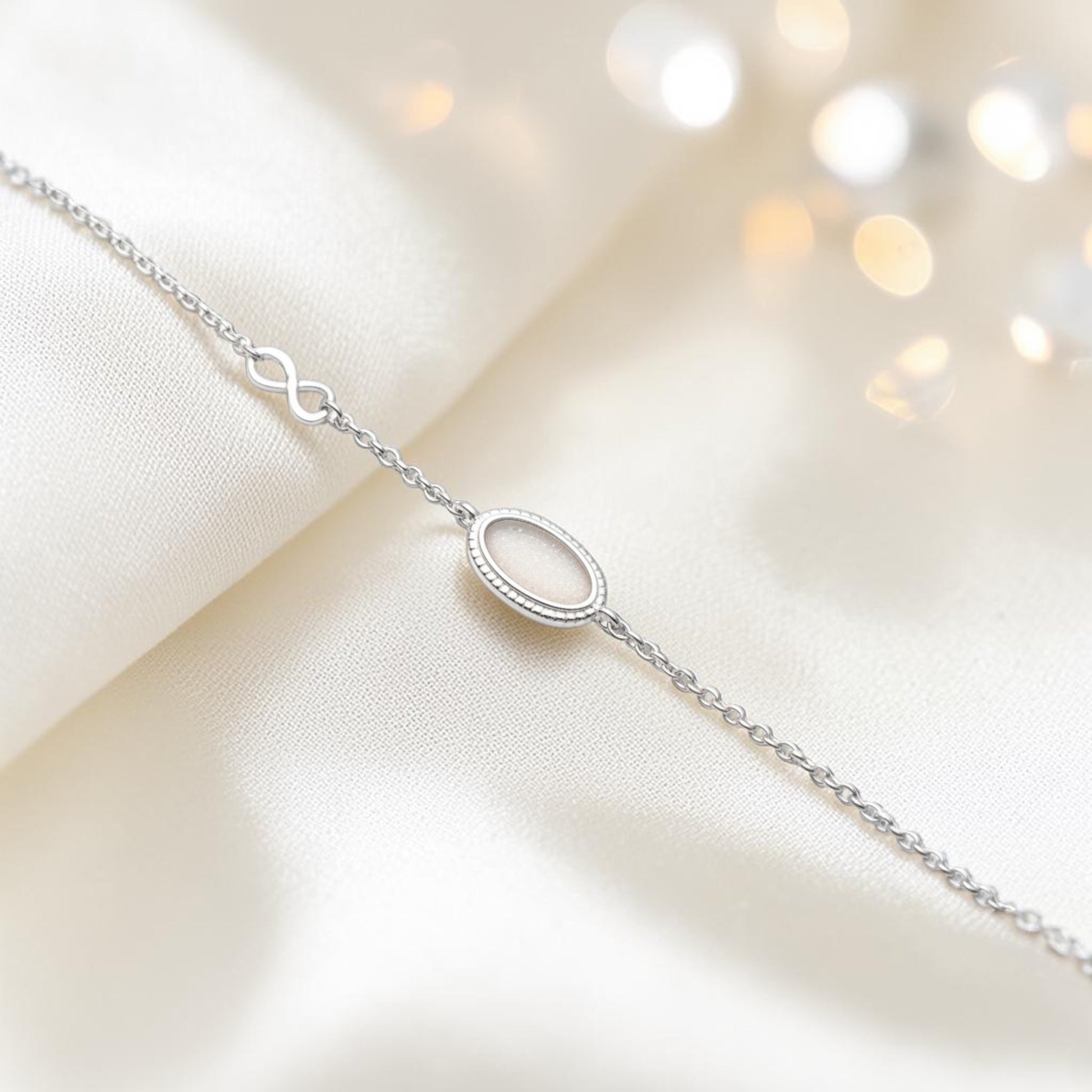 Lumen Bracelet — silver oval infinity ashes memorial bracelet, handcrafted in Lancashire, UK - by Keepsake Memorial Jewellery