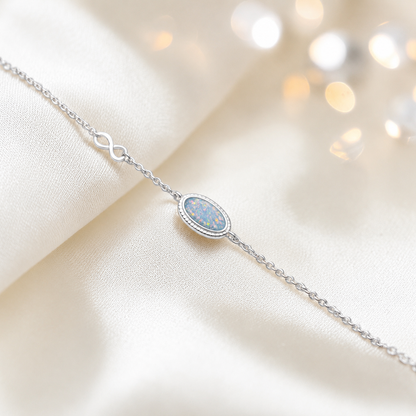 Lumen Bracelet — silver oval infinity ashes memorial bracelet in baby blue, handcrafted in Lancashire, UK - by Keepsake Memorial Jewellery