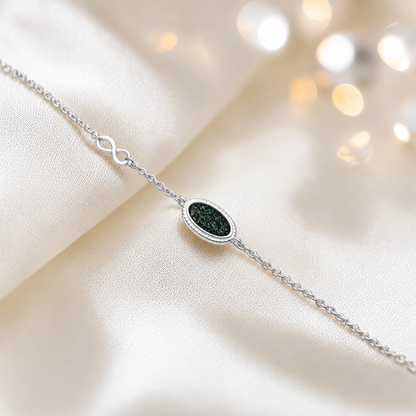 Lumen Bracelet — silver oval infinity ashes memorial bracelet in black flame, handcrafted in Lancashire, UK - by Keepsake Memorial Jewellery