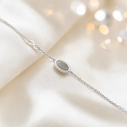 Lumen Bracelet — silver oval infinity ashes memorial bracelet in natural ash, handcrafted in Lancashire, UK - by Keepsake Memorial Jewellery