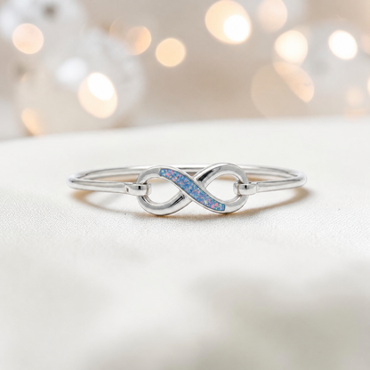 Lunara Bangle — silver infinity ashes memorial bangle in baby blue, handcrafted in Lancashire, UK - by Keepsake Memorial Jewellery