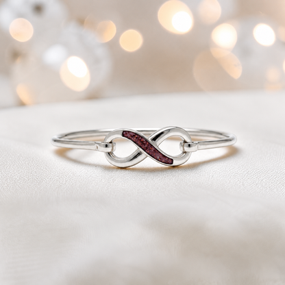 Lunara Bangle — silver infinity ashes memorial bangle in ruby red, handcrafted in Lancashire, UK - by Keepsake Memorial Jewellery