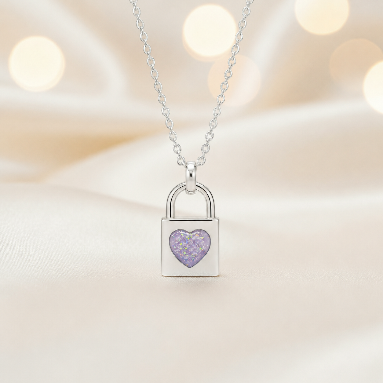 Mara sterling silver heart padlock pendant in unicorn purple, handcrafted in Lancashire UK