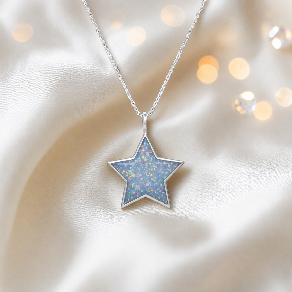 Merak sterling silver star memorial pendant in baby blue, handcrafted in Lancashire, UK