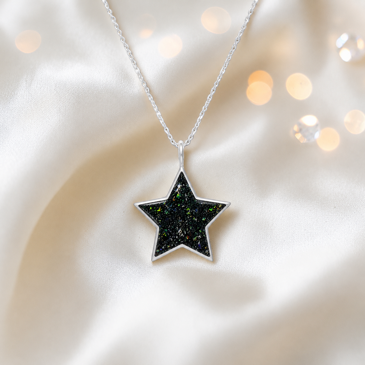 Merak sterling silver star memorial pendant in black flame, handcrafted in Lancashire, UK