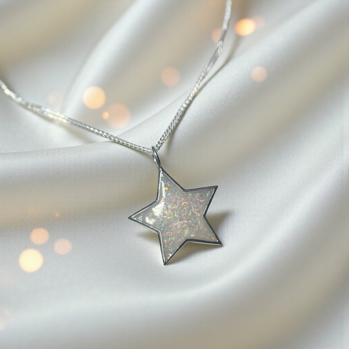 Merak sterling silver star memorial pendant in white snow, handcrafted in Lancashire, UK