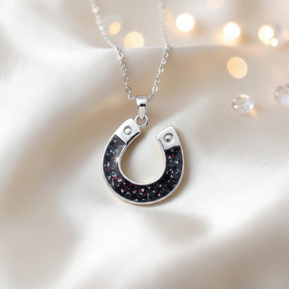 Midnight horseshoe ashes pendant in black flame, handcrafted in Lancashire UK - by Keepsake Memorial Jewellery