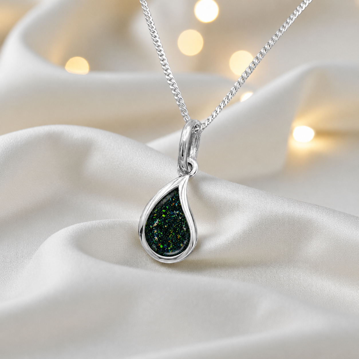 Milky teardrop memorial ashes pendant in black flame, handcrafted in Lancashire UK - by Keepsake Memorial Jewellery