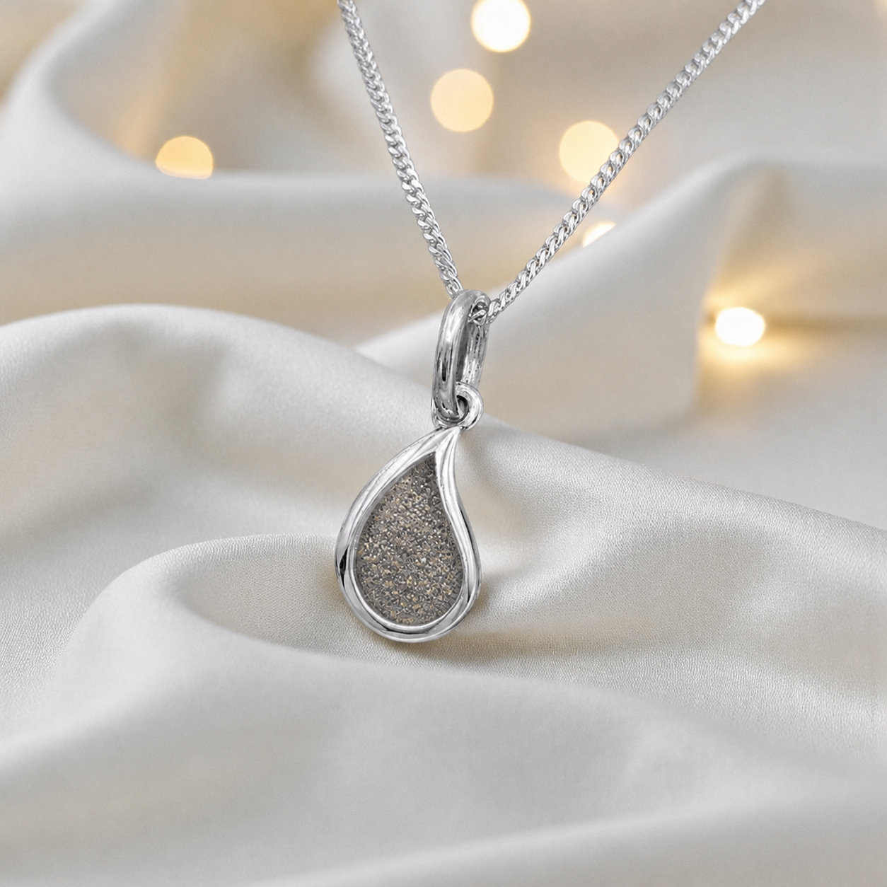 Milky teardrop memorial ashes pendant in natural ash, handcrafted in Lancashire UK - by Keepsake Memorial Jewellery