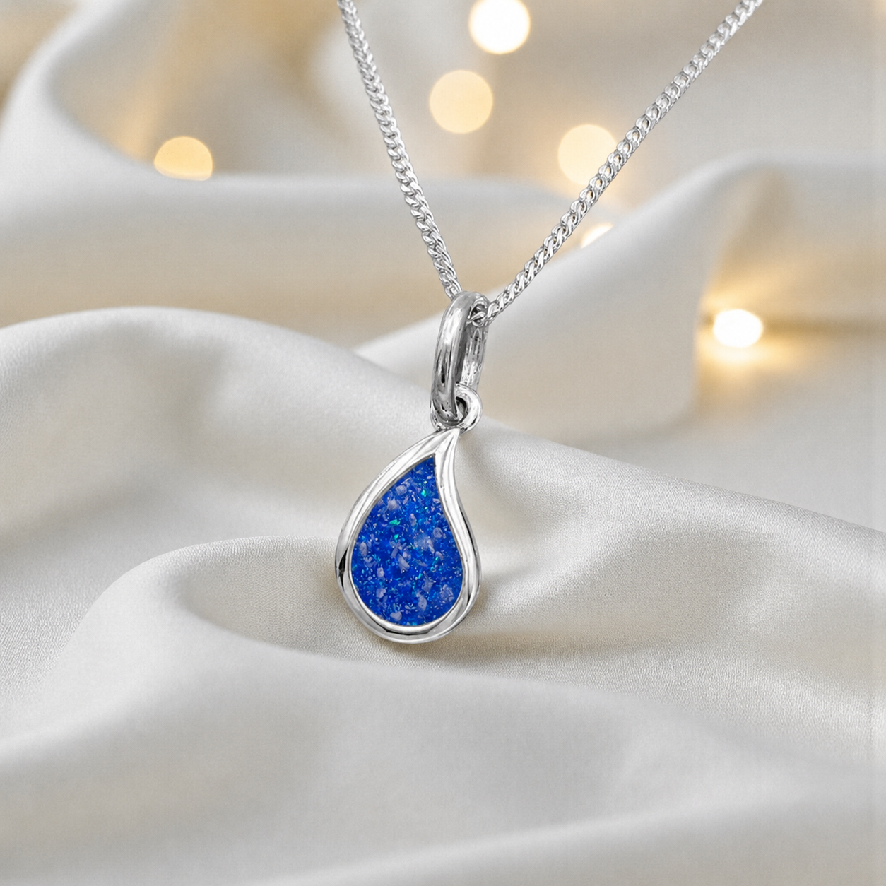 Milky teardrop memorial ashes pendant in royal blue, handcrafted in Lancashire UK - by Keepsake Memorial Jewellery