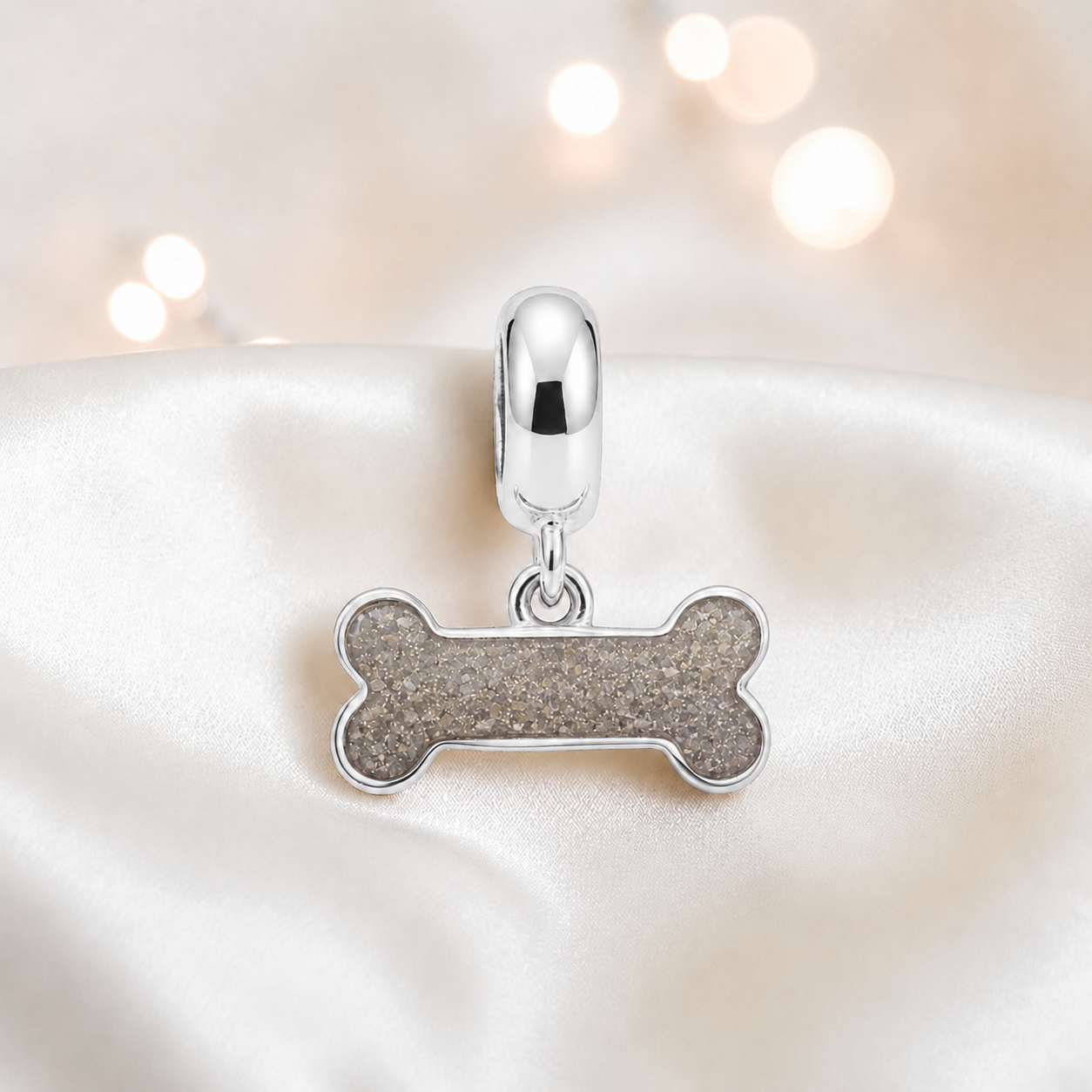 Milo silver dog bone ashes charm, in natural ash, handcrafted in Lancashire UK - by Keepsake Memorial Jewellery 