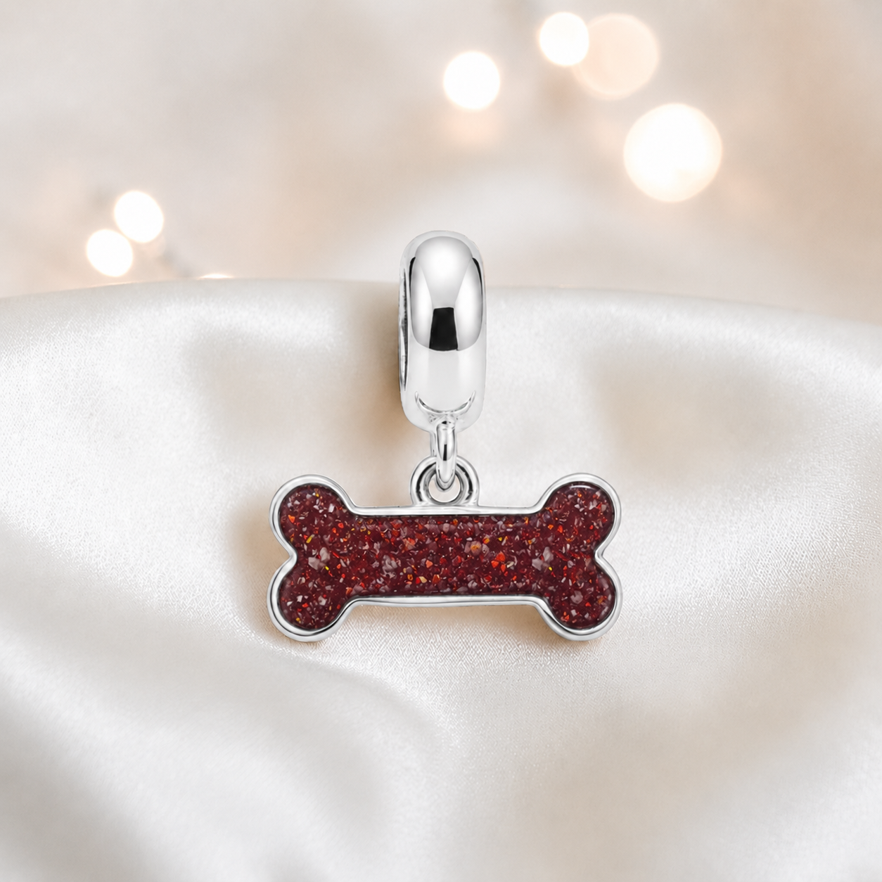 Milo silver dog bone ashes charm, in ruby red, handcrafted in Lancashire UK - by Keepsake Memorial Jewellery 