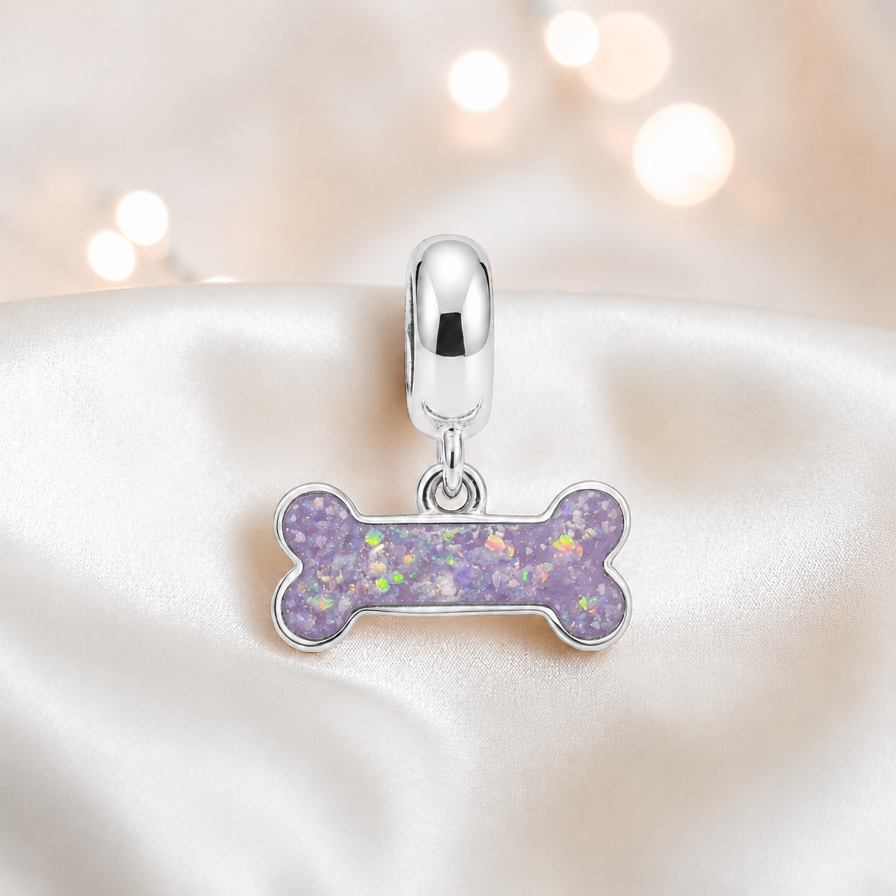 Milo silver dog bone ashes charm, in unicorn purple, handcrafted in Lancashire UK - by Keepsake Memorial Jewellery 