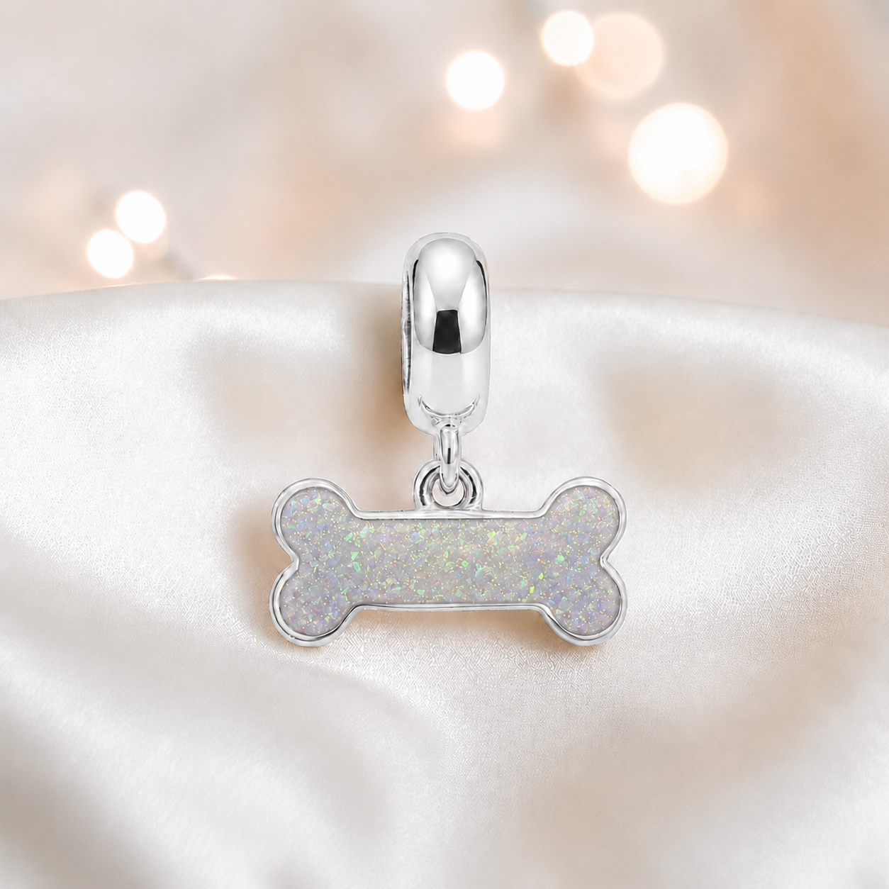 Milo silver dog bone ashes charm, in white snow, handcrafted in Lancashire UK - by Keepsake Memorial Jewellery 