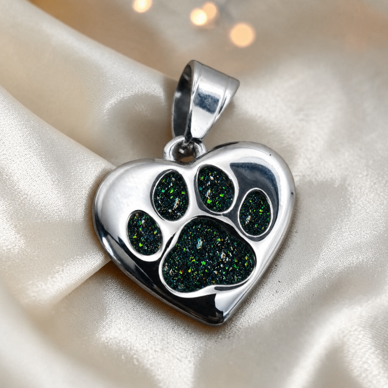 Milo paw keyring ashes charm in black flame, handcrafted in Lancashire UK - by Keepsake Memorial Jewellery