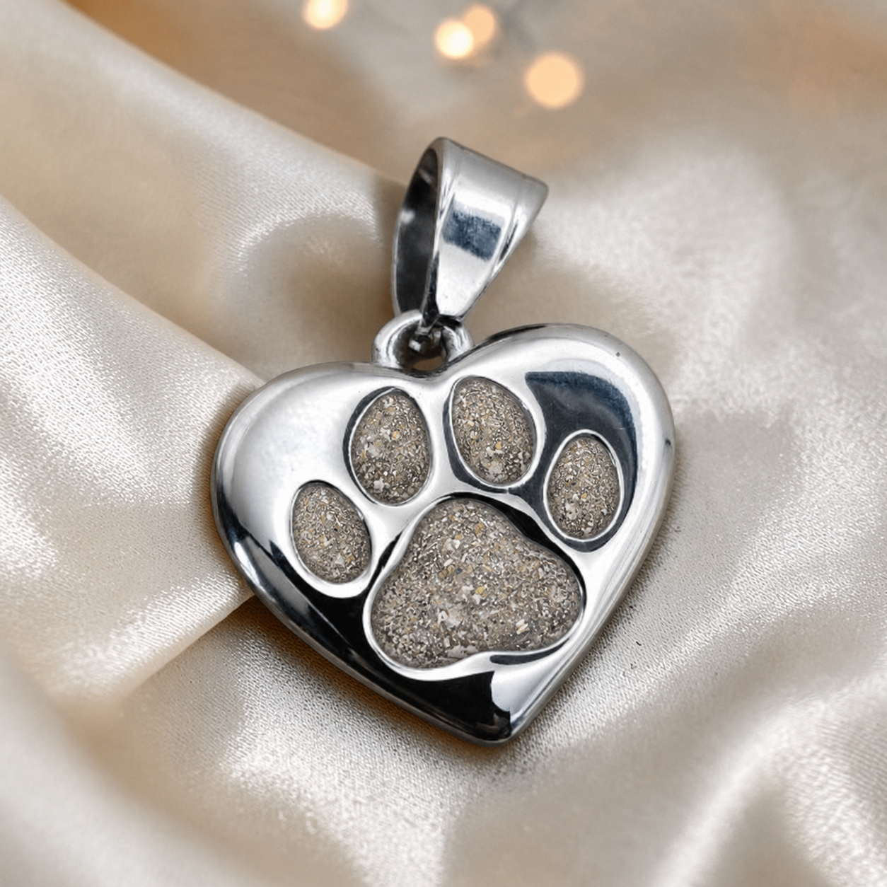 Milo paw keyring ashes charm in natural ash, handcrafted in Lancashire UK - by Keepsake Memorial Jewellery