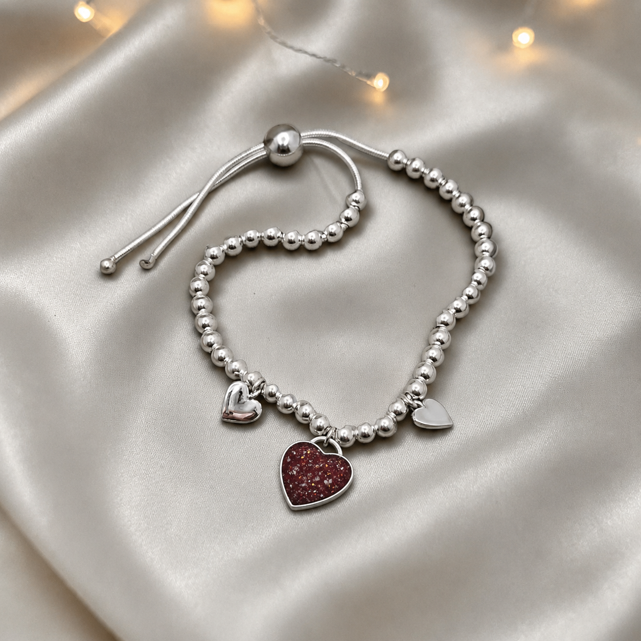 Nova memorial bracelet - three hearts beaded draw string bracelet, in ruby red, handcrafted in Lancashire UK - by Keepsake Memorial Jewellery