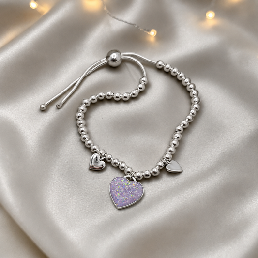 Nova memorial bracelet - three hearts beaded draw string bracelet, in unicorn purple, handcrafted in Lancashire UK - by Keepsake Memorial Jewellery