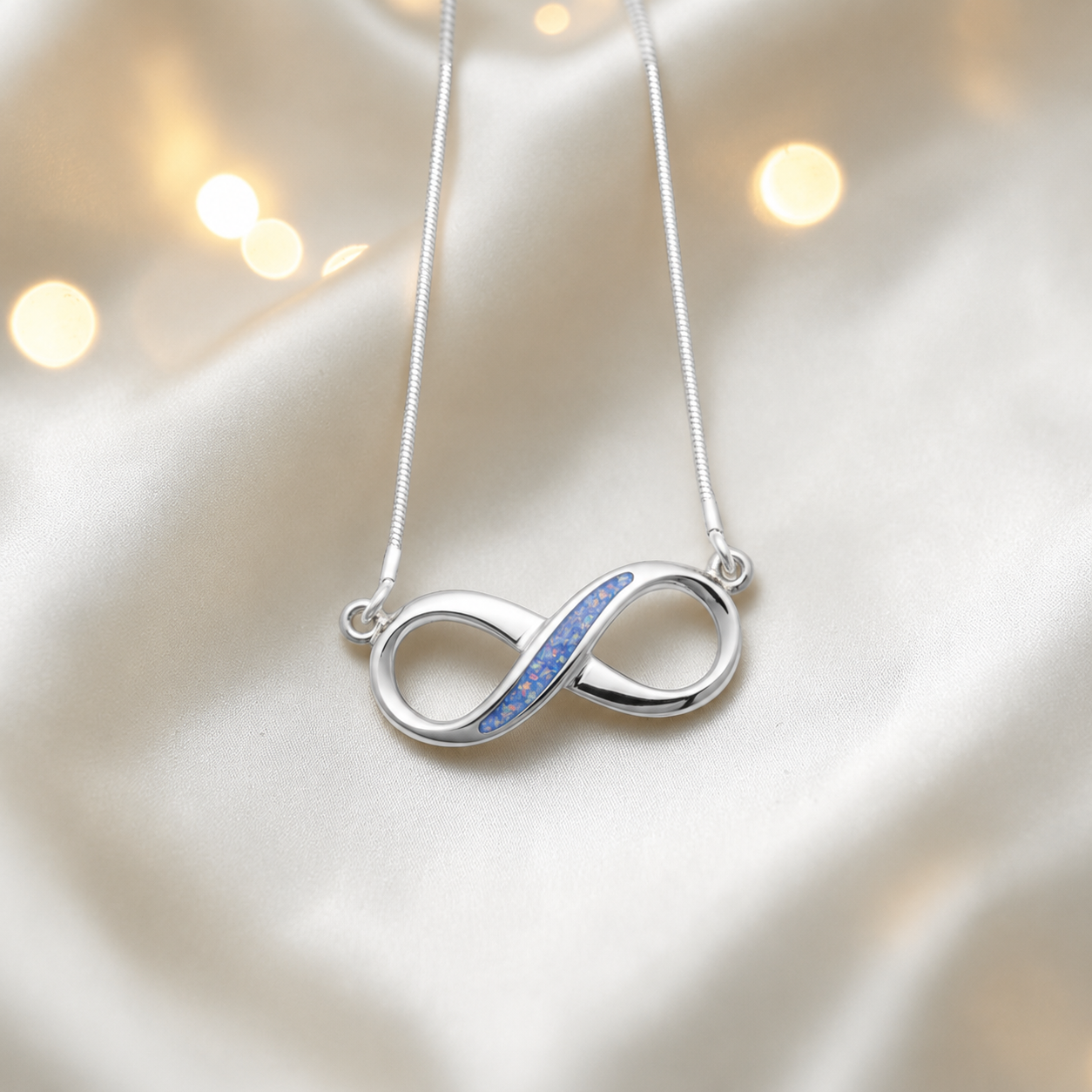 Nunki infinity memorial pendant in baby blue, handcrafted in Lancashire UK - by Keepsake Memorial Jewellery