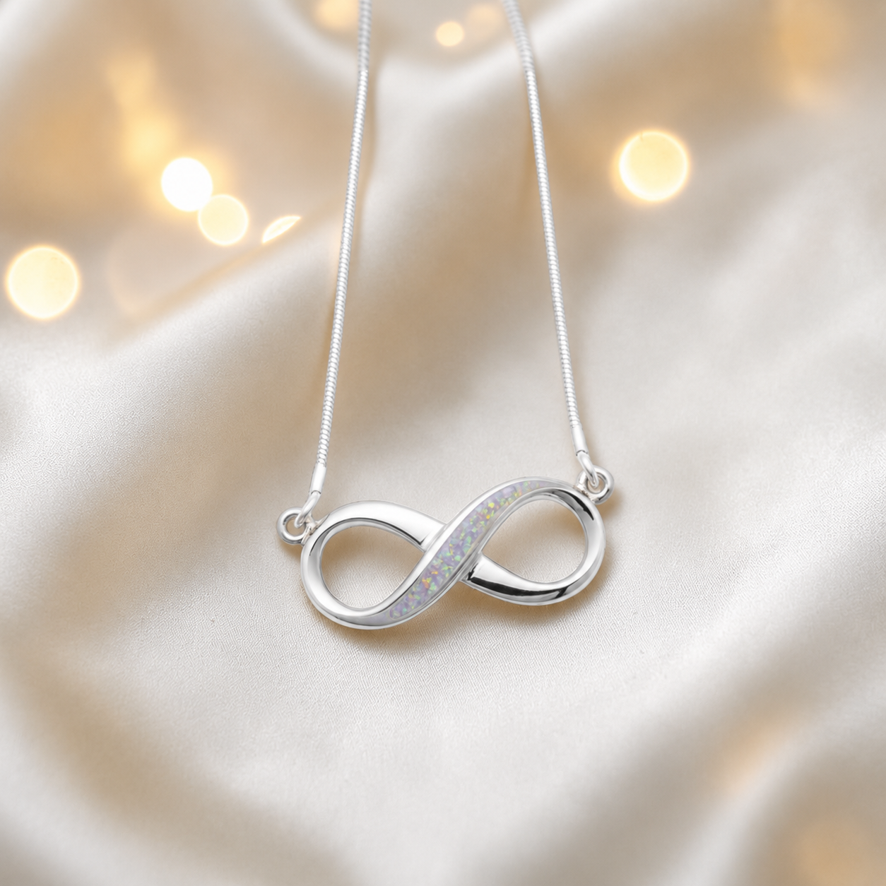 Nunki infinity memorial pendant in white snow, handcrafted in Lancashire UK - by Keepsake Memorial Jewellery