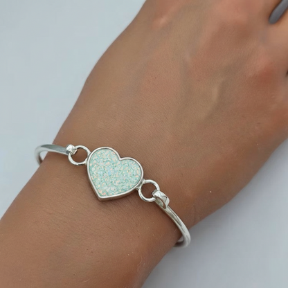 Nyx Bangle — silver ashes memorial bangle with spearmint opal worn on wrist, handcrafted in Lancashire, UK