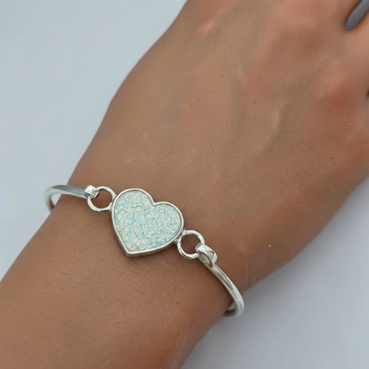 Nyx Bangle — silver ashes memorial bangle with spearmint opal worn on wrist, handcrafted in Lancashire, UK