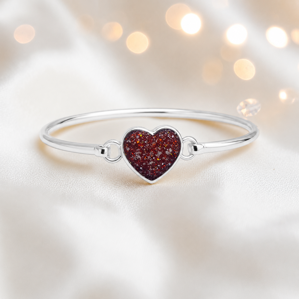 Nyx Bangle — silver heart shaped ashes memorial bangle in ruby red, handcrafted in Lancashire, UK - by Keepsake Memorial Jewellery