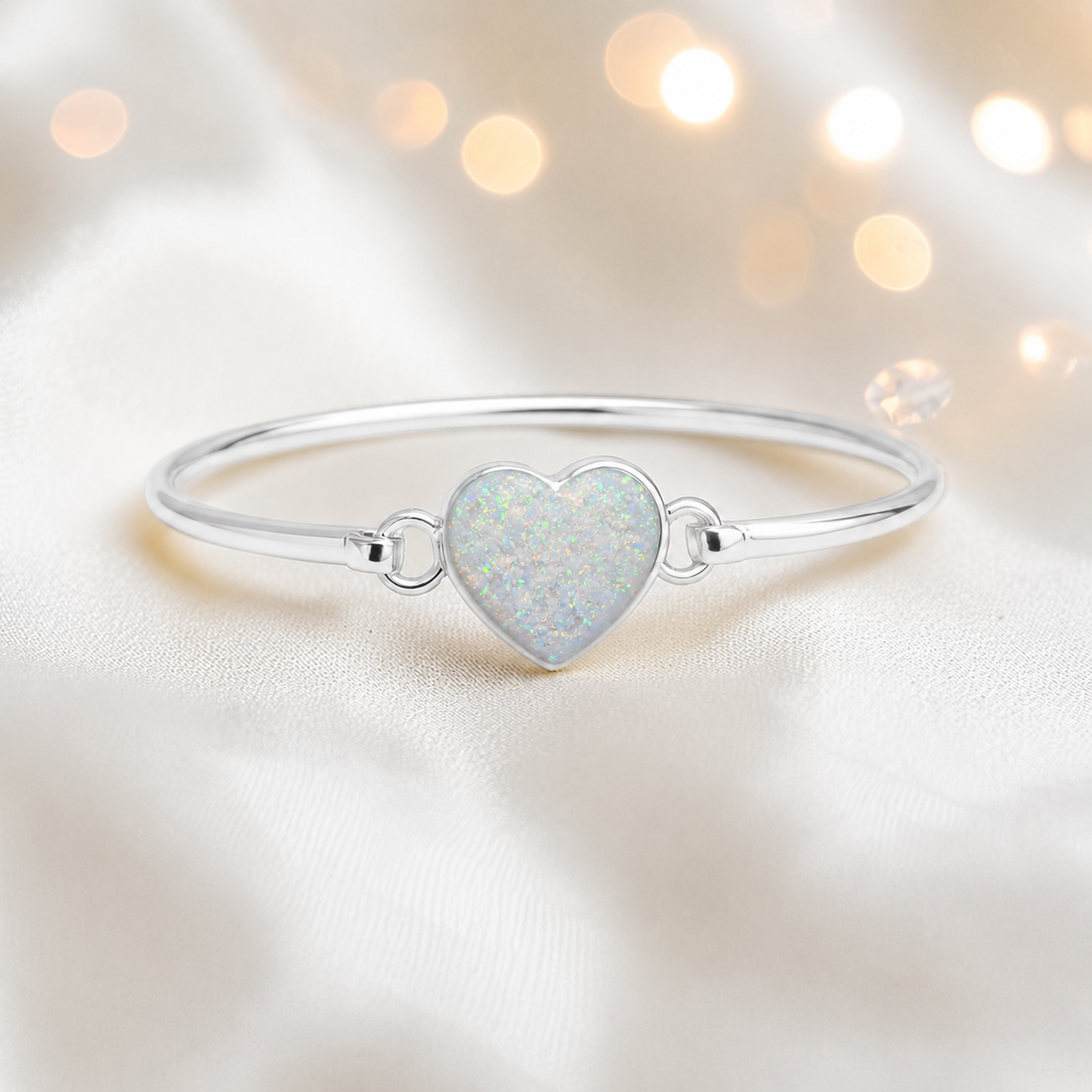 Nyx Bangle — silver heart shaped ashes memorial bangle in white snow, handcrafted in Lancashire, UK - by Keepsake Memorial Jewellery
