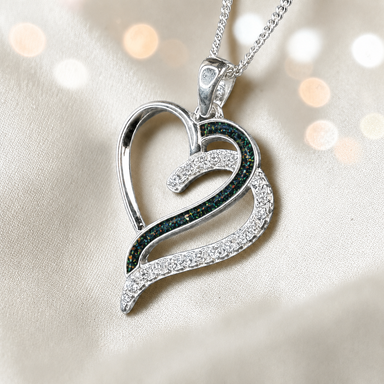 Olive Heart shaped memorial ashes pendant with CZ stones and black flame. handcrafted in Lancashire, UK.