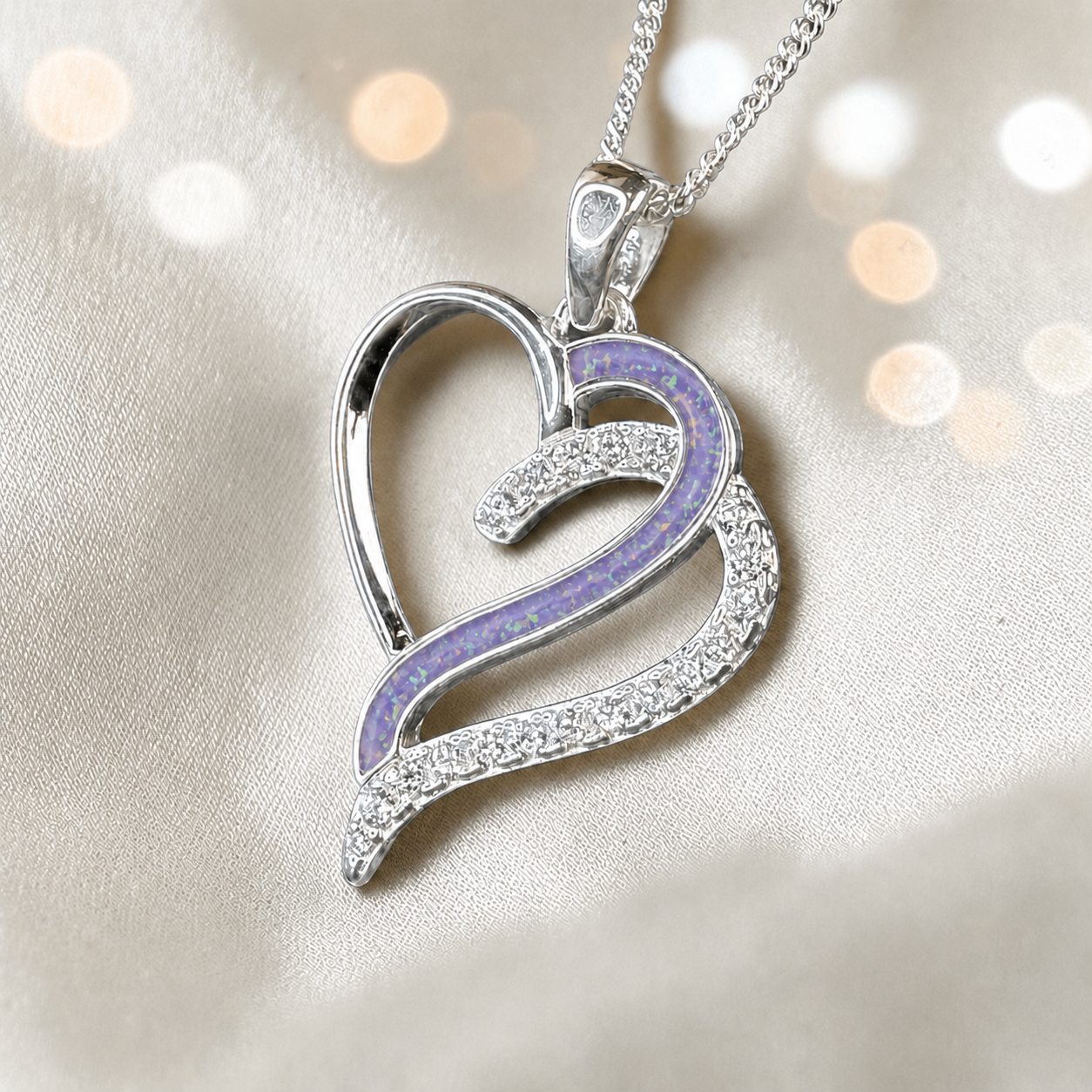 Olive Heart shaped memorial ashes pendant with CZ stones and unicorn purple. handcrafted in Lancashire, UK.