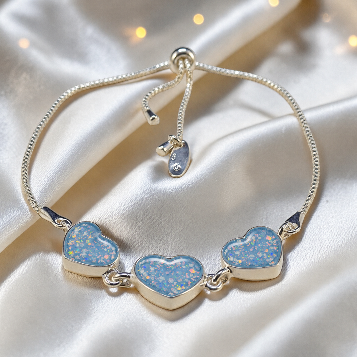 Orion Bracelet — silver three heart ashes memorial bracelet, in baby blue,  handcrafted in Lancashire, UK - by Keepsake Memorial Jewellery