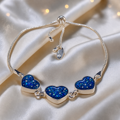 Orion Bracelet — silver three heart ashes memorial bracelet, in sapphire glow, handcrafted in Lancashire, UK - by Keepsake Memorial Jewellery