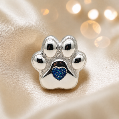 Pawprint of love, Stainless steel paw print ashes ornament in sapphire glow, handcrafted in Lancashire, UK - by Keepsake Memorial Jewellery
