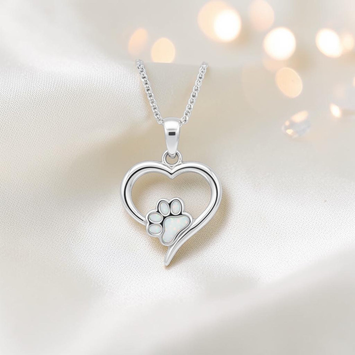 Penny Paw Pendant - heart shaped ashes memorial pendant with paw detail in white snow, handcrafted in Lancashire UK - by Keepsake Memorial Jewellery