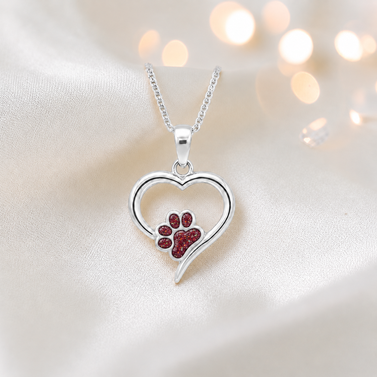 Penny Paw Pendant - heart shaped ashes memorial pendant with paw detail in ruby red, handcrafted in Lancashire UK - by Keepsake Memorial Jewellery