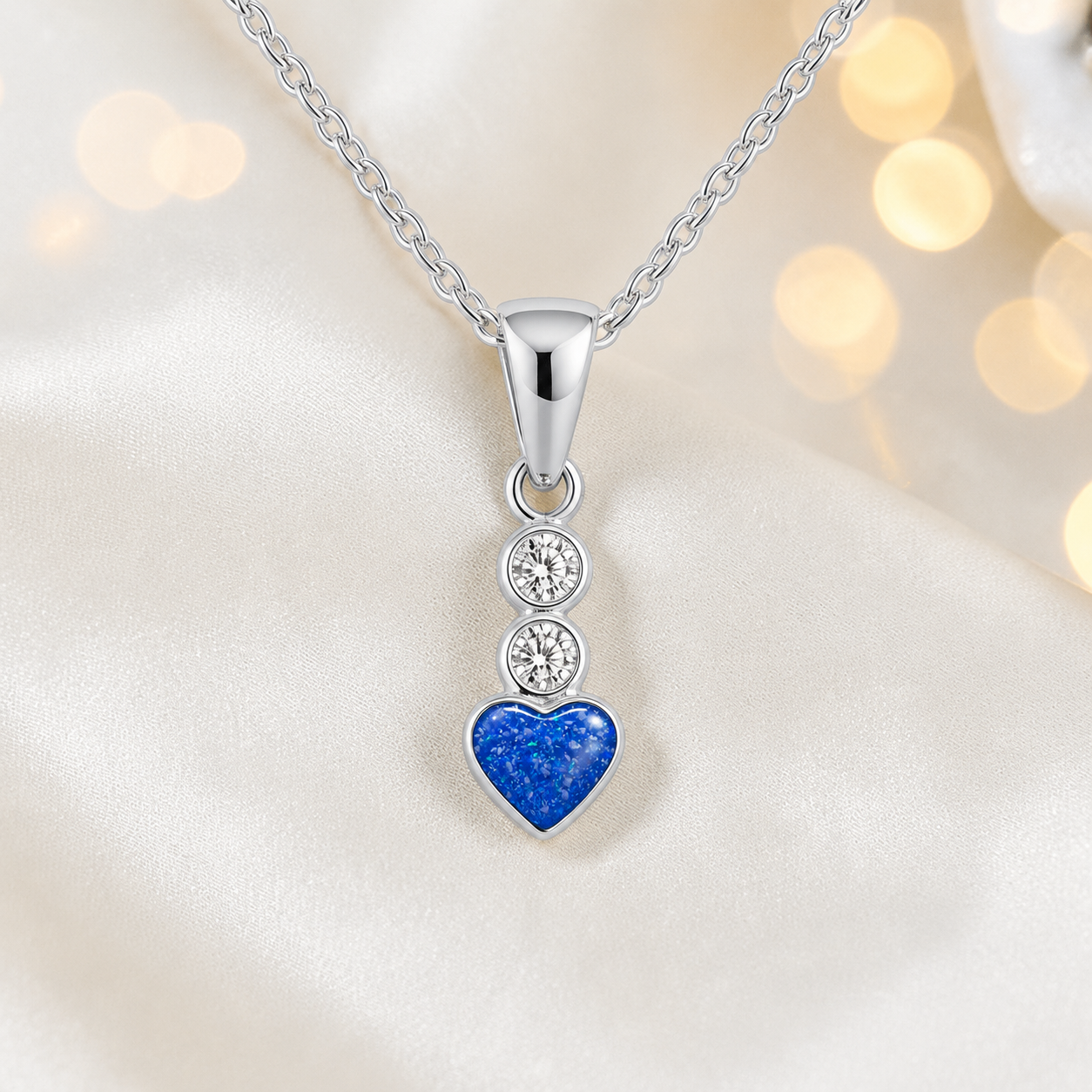 Pleione dainty heart ashes pendant in royal blue, handcrafted in Lancashire UK - by Keepsake Memorial Jewellery