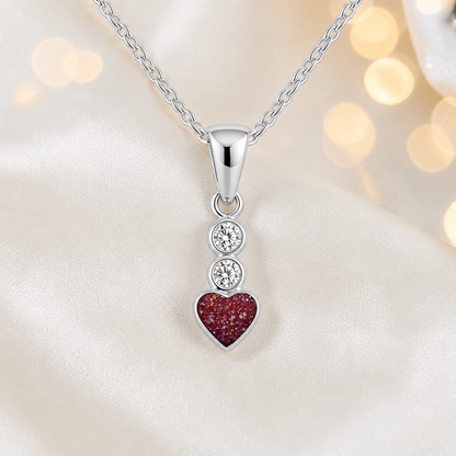 Pleione dainty heart ashes pendant in ruby red, handcrafted in Lancashire UK - by Keepsake Memorial Jewellery