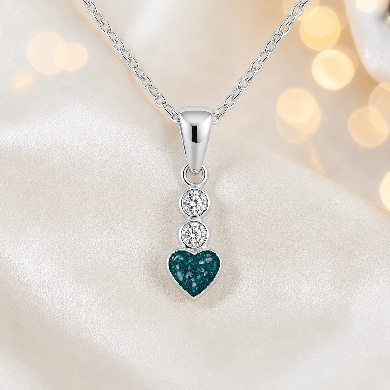 Pleione dainty heart ashes pendant in teal mist, handcrafted in Lancashire UK - by Keepsake Memorial Jewellery
