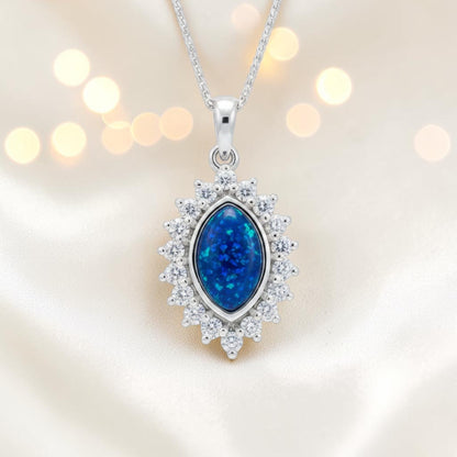 Princess CZ oval ashes pendant in sapphire blue, handcrafted in Lancashire UK