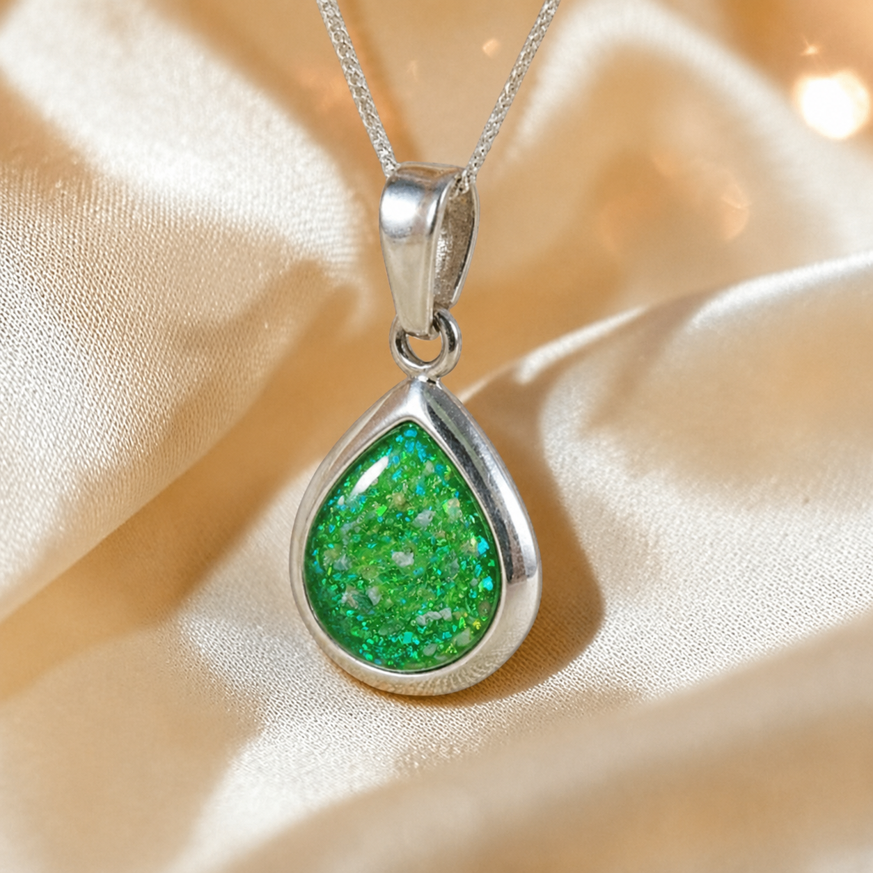 Procyon pear shaped ashes pendant in fruit green, handcrafted in Lancashire UK