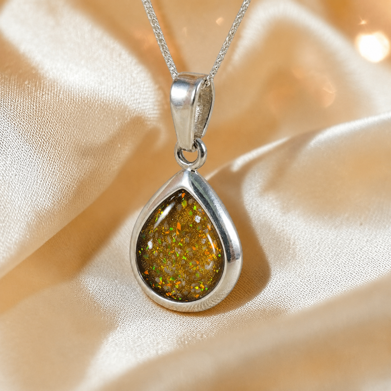 Procyon pear shaped ashes pendant in gold olive, handcrafted in Lancashire UK