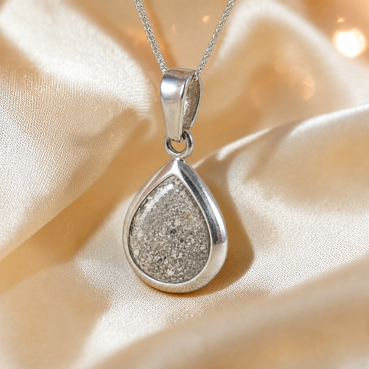 Procyon pear shaped ashes pendant in natural ash, handcrafted in Lancashire UK