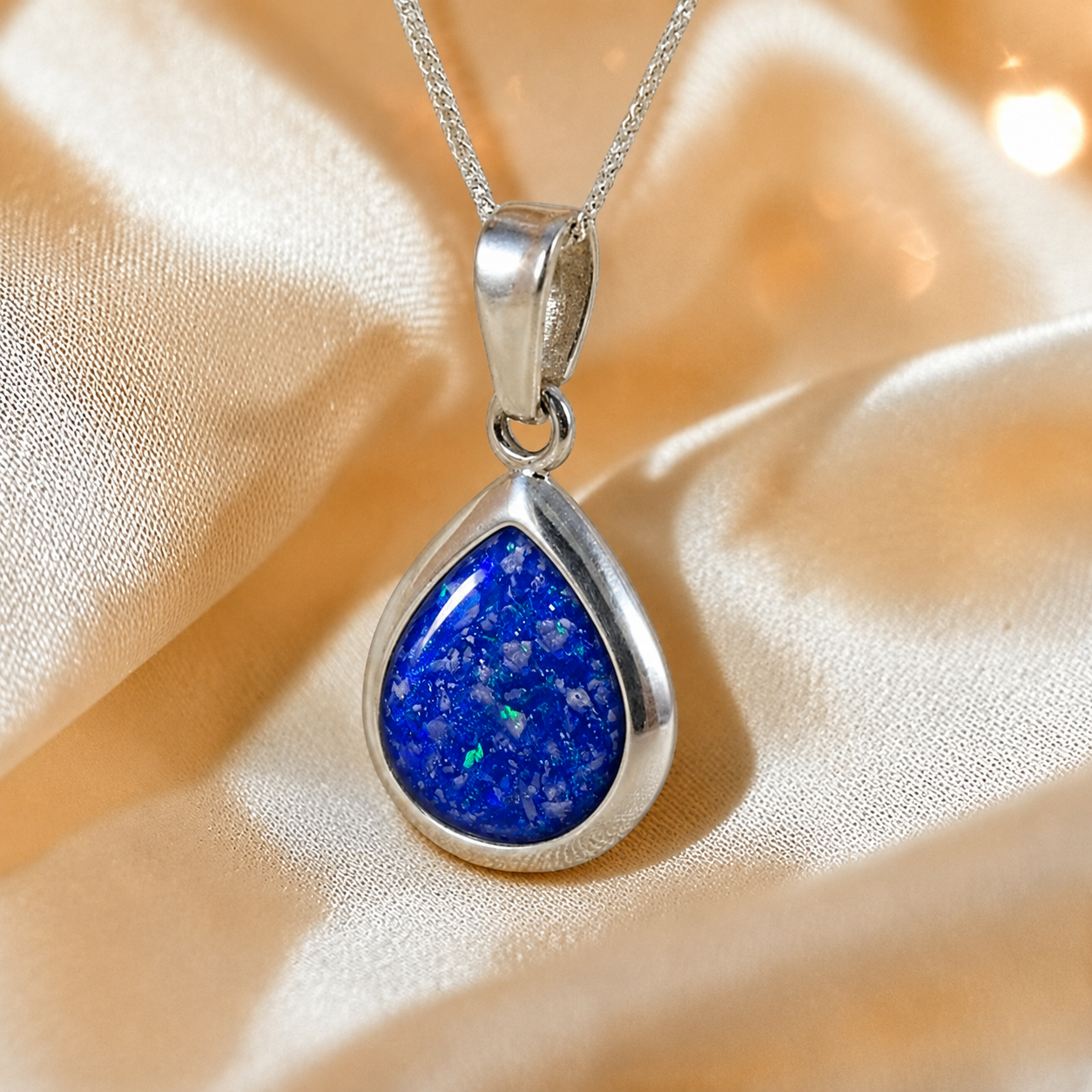 Procyon pear shaped ashes pendant in royal blue, handcrafted in Lancashire UK